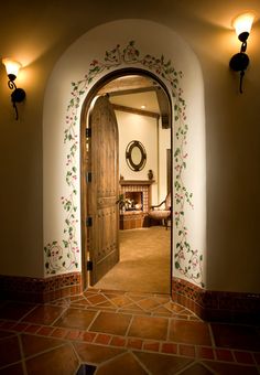 an arched doorway leading into a living room