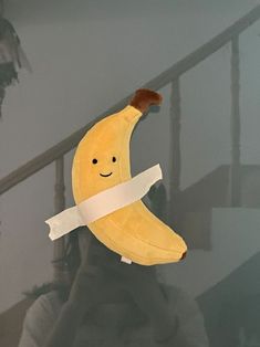 a banana that has been taped to the wall