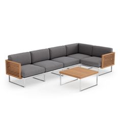 an outdoor sectional sofa with two tables and one coffee table in front of the couch