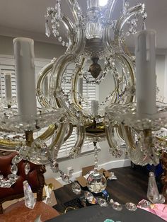 a chandelier hanging from the ceiling in a living room