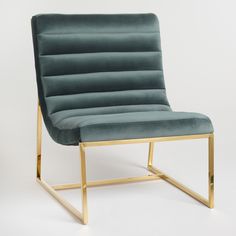 a green chair with gold legs on a white background