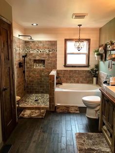 a bathroom with wooden floors and tile walls