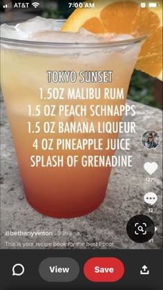 an orange drink in a glass with the text tokyo sunset on it's side