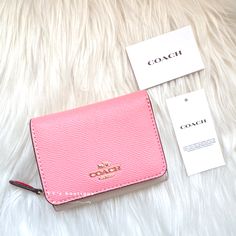 Color: Candy Pink Multi Material: Crossgrain Leather Condition: Brand New With Tag Style Number: 2923 Dimensions: 4" (L) X 3 1/4" (H) X 1 1/2" (W) Two Credit Card Slots Full-Length Bill Compartment Id Window Snap Closure Outside Zip Coin Pocket Our Crossgrain Leather Small Trifold Wallet Is Secured By A Snap Closure And Perfectly Organized To Hold Cards And Cash. 100% Authentic Price Is Firm Comes From Clean & Pet Free Environment Rare Find Sold Out Everywhere Pink Wallet Coach, Coach Trifold Wallet For Daily Use, Saving List, Window Snap, Clear Backpacks, Color Candy, Perfectly Organized, List Ideas, Coach Wallet