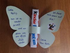 a toothpaste butterfly with writing on it