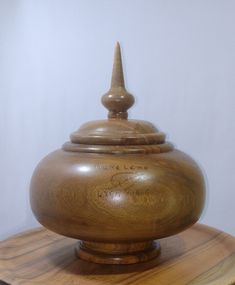 a wooden container sitting on top of a table