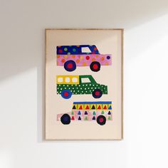 a painting hanging on the wall with cars painted on it