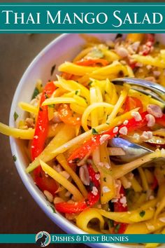 the cover of thai mango salad is shown with a fork in it's bowl