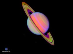 the planet saturn with its rings glowing in red and yellow light, against a black background