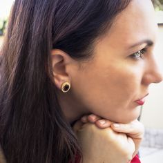 Crafted from 18-karat gold vermeil, this pair of stud earrings from our 'Luccichio' collection is carefully handmade in our workshop in Italy, set with two genuine bloody garnet cabochons. Understated and elegant, it will add a glittering detail to your everyday outfit so as it will do with your evening styles. Garnet helps us feel grounded and connected to the present moment. If you're lacking in energy, it could be energy blockages within the body keeping you from your natural state of joy and Single Yellow Gold Earring As Gift For Her, Plating Techniques, Earrings Outfit, The Present Moment, Present Moment, Cameo Ring, Italian Jewelry, Garnet Earrings, Everyday Outfit