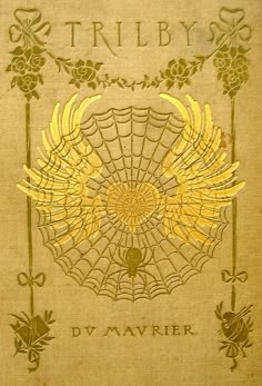 the front cover of a book with gold foil on it, and an intricate design