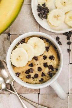 two white bowls filled with oatmeal and banana slices