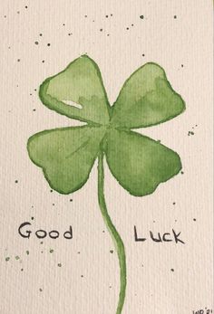 a painting of a four leaf clover with the words good luck written on it in black ink