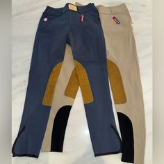 two equestrian pants sitting on top of each other