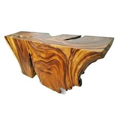 a wooden table that is made out of some kind of wood and has an interesting shape