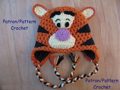 a crocheted hat with a tiger on it