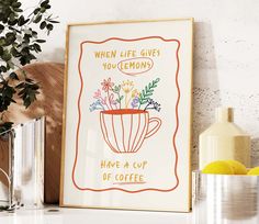 there is a coffee cup with flowers in it and the words when life gives you lemons have a cup of coffee