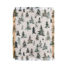 a blanket with trees printed on it and fringes around the edges, in white background