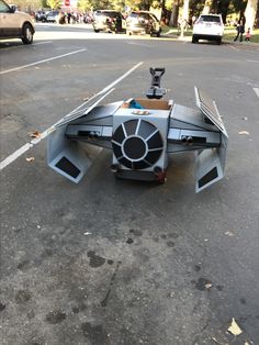 a star wars vehicle is parked on the street