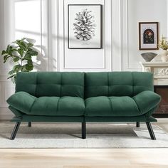 a living room with a green couch in it