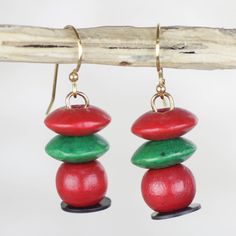 Ideal for the bohemian styled fashionista these earrings are handcrafted by Ghanaian jewelry designer Catherine Offei Kwapong. Red and green sese wood beads create eye-catching formations that culminate recycled plastic discs making this an environmentally friendly accessory. They dance on brass hooks. Wood Dangle Earrings, Dangle Earrings Boho, Brass Hook, Buy Wood, Beaded Dangle Earrings, Beaded Dangles, Recycled Plastic, Boho Earrings, Wood Beads