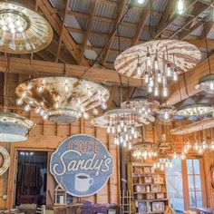 a restaurant with chandeliers hanging from the ceiling