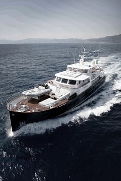 a large boat sailing in the ocean on a sunny day