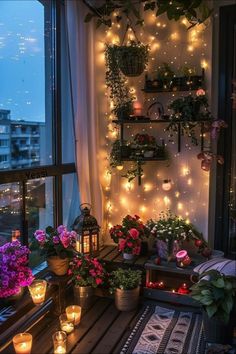 the balcony is decorated with potted plants and lite - up candles for decoration