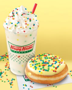 a doughnut next to a drink with sprinkles