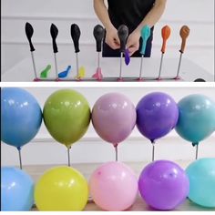 there are many balloons on the table and one is being put in front of them