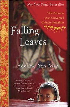 the book falling leaves by adelin yen mah is sitting on a table