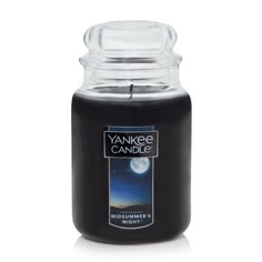 yankee candle midsummer's night with an image of the moon in the sky on it