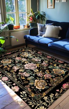 a living room with a blue couch and rug