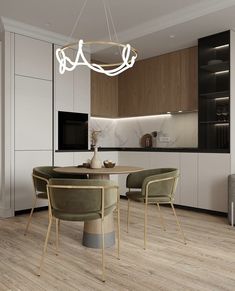 a modern dining room and kitchen with wood flooring, white walls and wooden cabinets