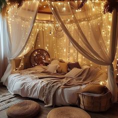 a bed with lights on the ceiling and some pillows in front of it that have been made to look like a canopy