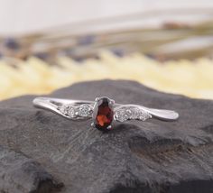 Womens Garnet Promise Ring, Silver Garnet Ring, Dainty Promise Ring, Womens Silver Ring, Minimalist Ring,Delicate Silver Ring,Red Stone Ring WE OFFER UNLIMITED PERIOD INSTALLMENTS PLAN This is a beautiful, stunning, feminine ring that works well for all occasions, styles, and ages. You will love it! Ring information: Main stone: Garnet Approximate size: 5*3mm Accent Stone: White cubic zirconia Approximate size: 1.75mm (2 stones) Approximate size: 1.5mm (2 stones) Approximate size: 1.25mm (2 ston Classic Sterling Silver Ruby Promise Ring, Red Crystal Promise Ring With Accent Stones, Red Garnet Promise Jewelry, Minimalist Sterling Silver Ruby Promise Ring, Silver Garnet Birthstone Ring For Promise, Delicate Silver Rings, Garnet Ring Silver, Red Stone Ring, Fancy Gifts