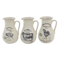 three white pitchers with farm animals on them