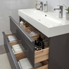 a bathroom sink with drawers underneath it