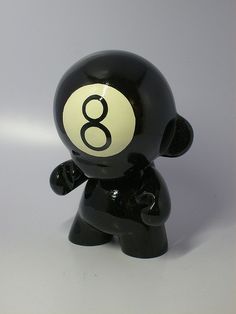 a black bear figurine with the number eight on it's face and hands