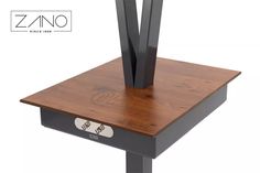 a wooden table with two metal legs and a wood top that has the word zino on it