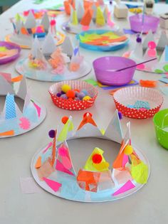 paper plates and bowls filled with different types of crafts