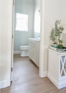 the bathroom is clean and ready to be used as a home office or guest room