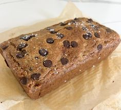 a loaf of chocolate chip bread on wax paper