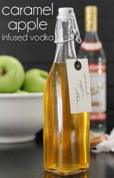 caramel apple infused vodka in a glass bottle with an empty tag on the top