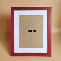 a red and white frame with the number 8x10