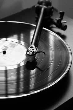 an old record player is playing music on the turntable