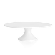 a white cake plate on a white background with no one around it to see the image