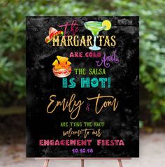 a chalkboard sign that says margaritas are cold and the salsa is hot, enjoy & ton