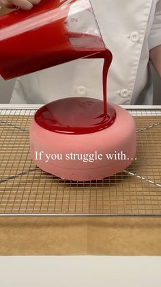 a person pouring red liquid on top of a pink object with the words if you struggle with