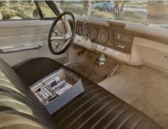 the interior of an old car is clean and ready to be used as a work station